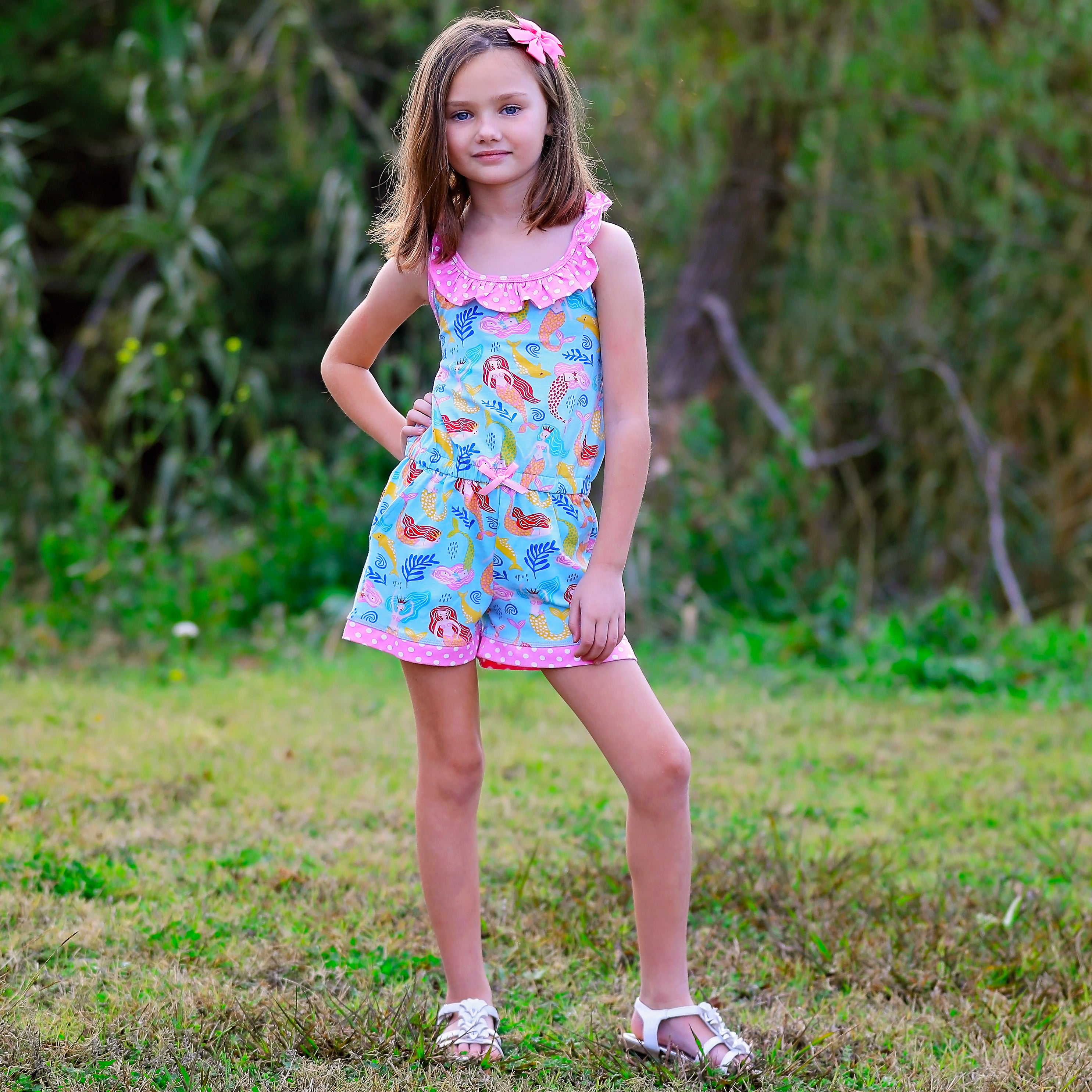 AnnLoren Girls Boutique Nautical Mermaid Jumpsuit featuring criss-cross straps and a bow, perfect for spring and summer.